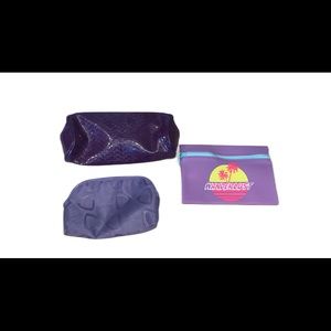 Three (3) purple small bags.  Clinique, Ipsy and one that isn’t labeled